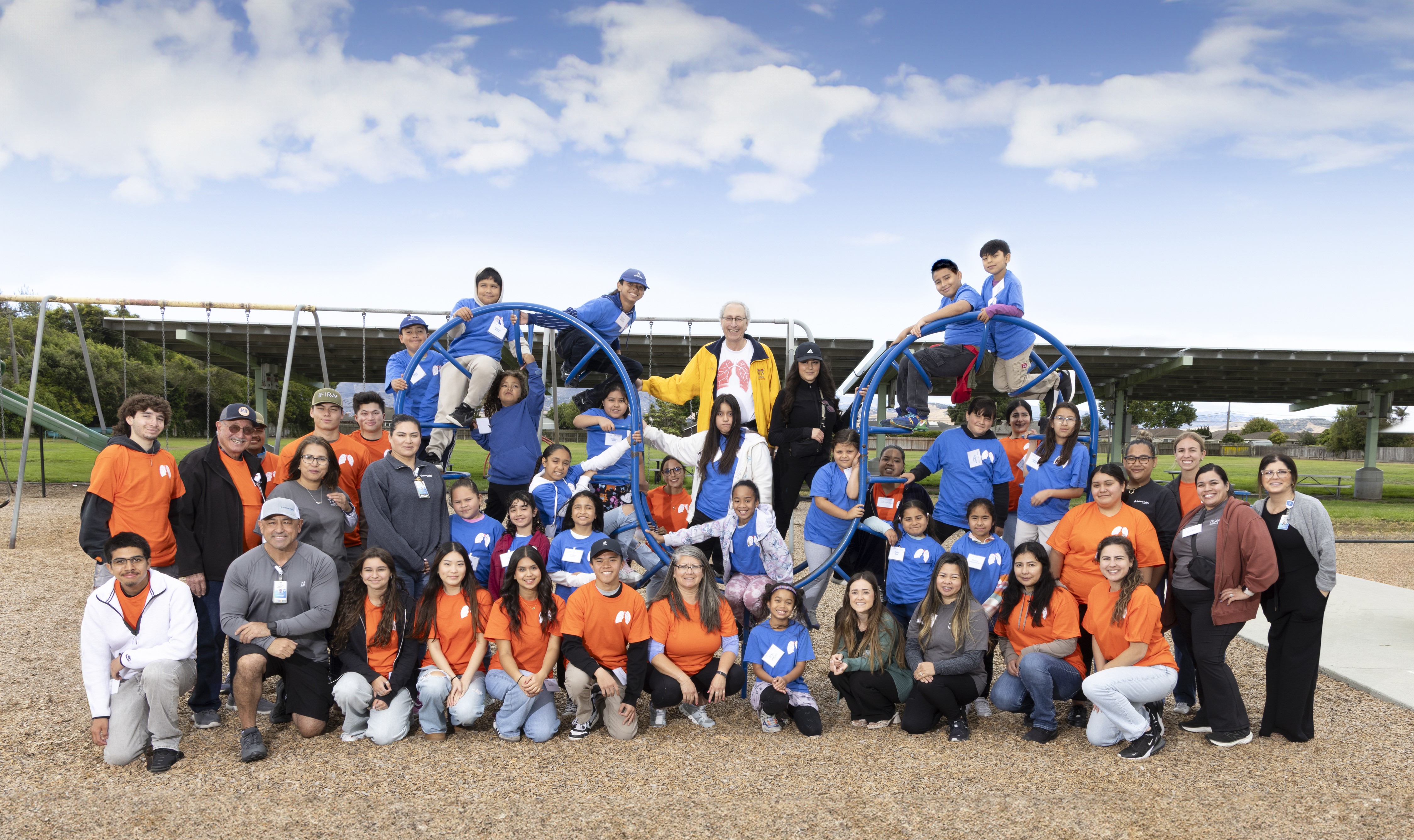 Group of people standing outside.